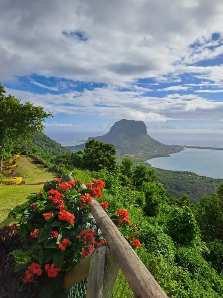 Scenic view of Le Morne mountain with lagoon and flowers showing the beauty of Mauritius and When to Book a Mauritius Holiday