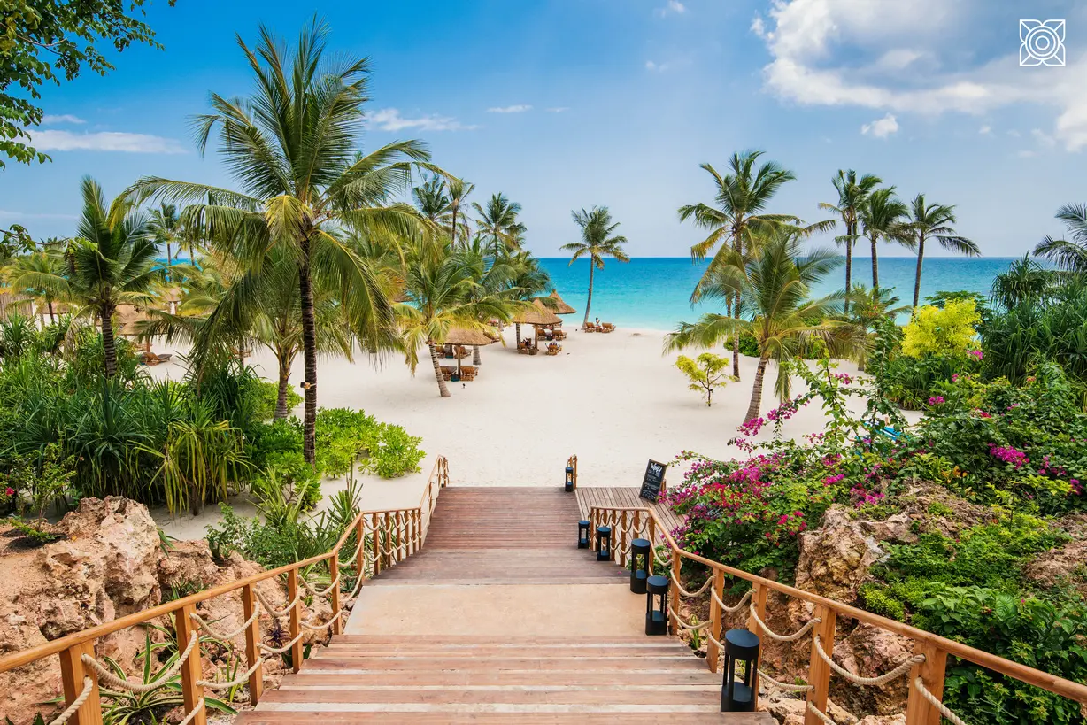 Beach access pathway through lush gardens at Zuri Zanzibar