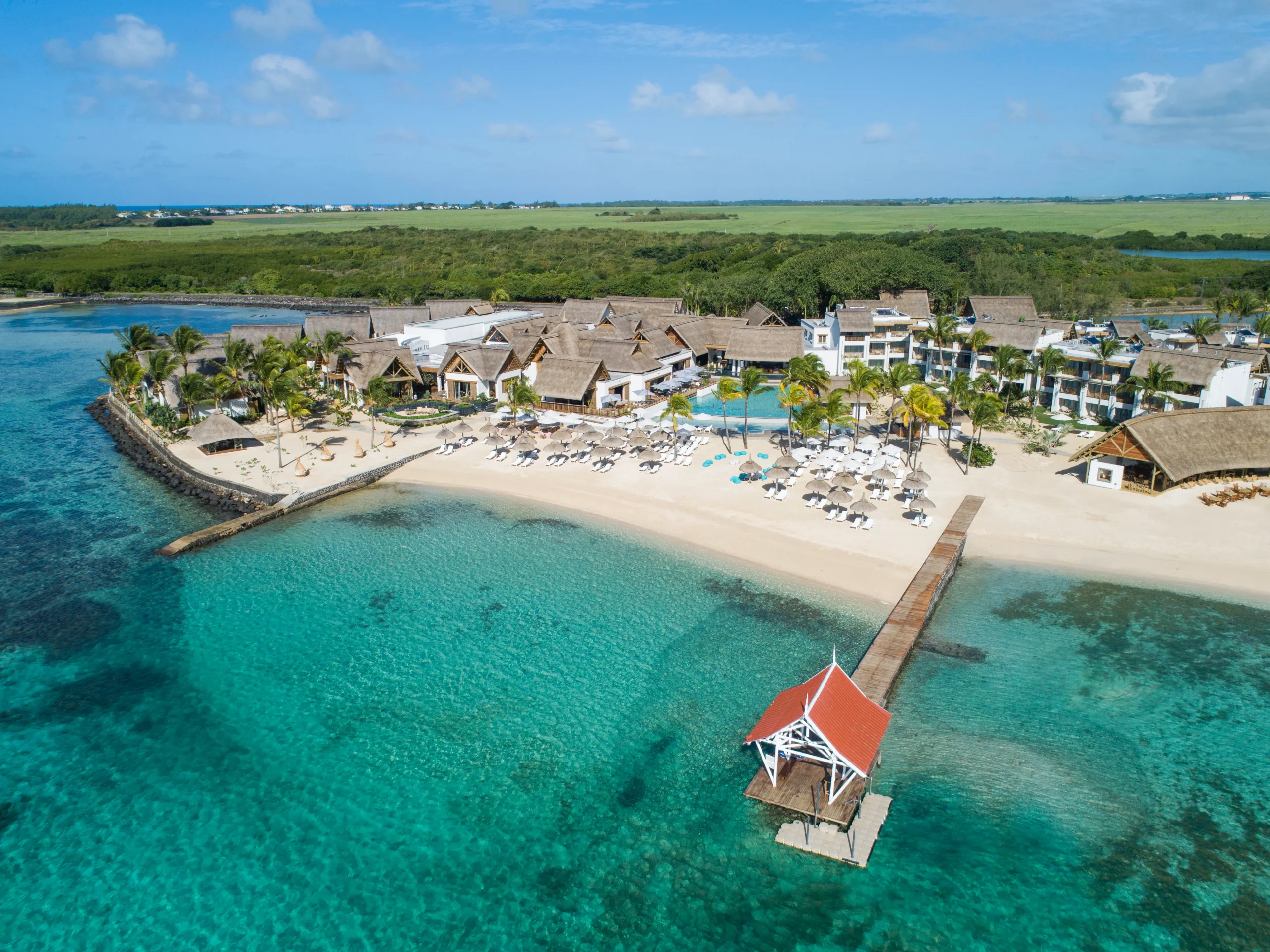 Beachfront aerial view showcasing Preskil Island Resort lagoon setting
