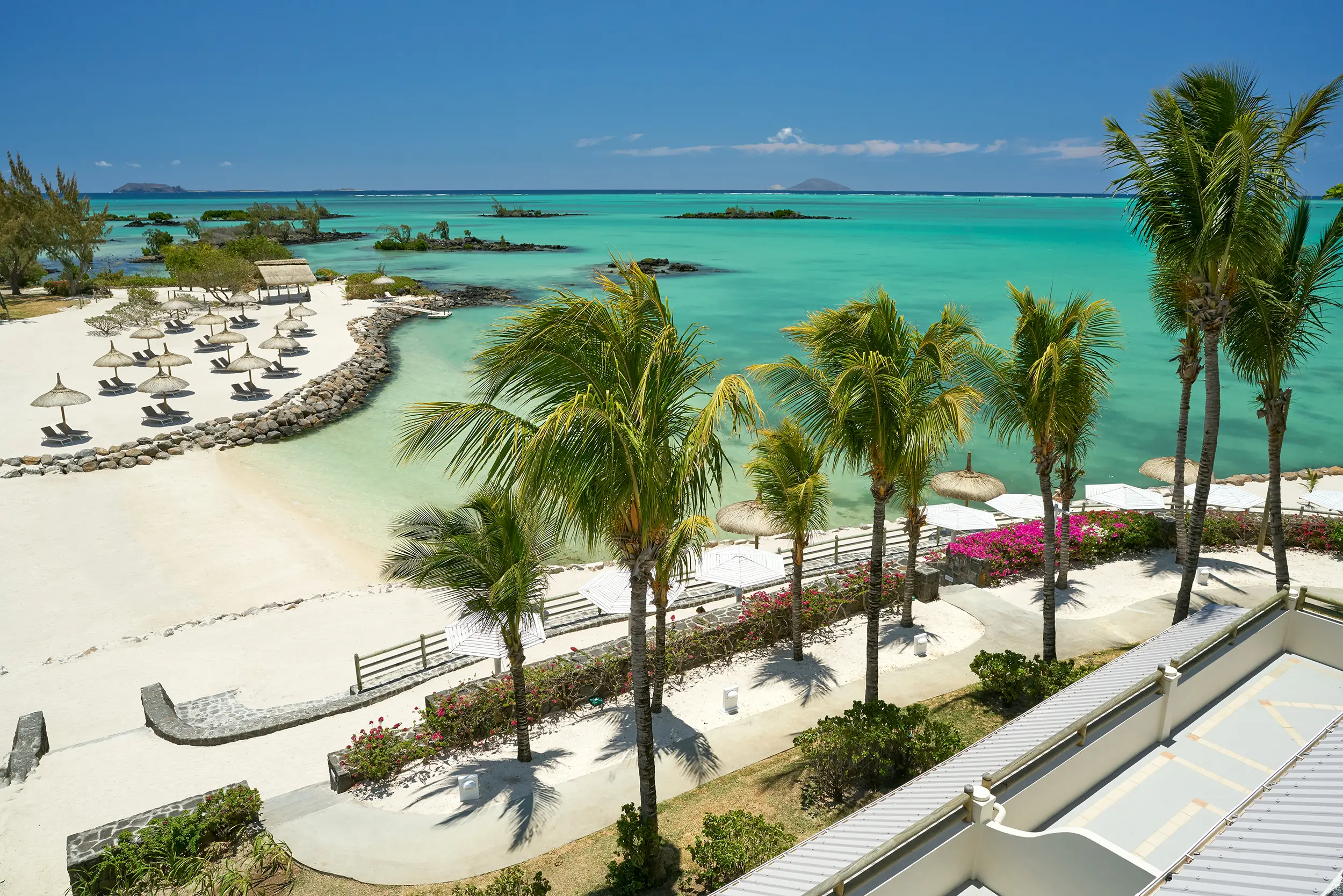 Lagoon Attitude Mauritius beachfront with palms and turquoise ocean